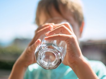 Boy drinking from a glass